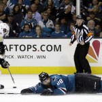Pittsburgh Penguins' Matt Cullen, left, moves the puck past San Jose Sharks' Brent Burns (88) during the third period of Game 4 of the NHL hockey Stanley Cup Finals on Monday, June 6, 2016, in San Jose, Calif. Pittsburgh won, 3-1. (AP Photo/Ben Margot)