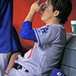 Los Angeles Dodgers' Kenta Maeda, of Japan, sits in the dugout after being struck on the right leg by a ball hit by Arizona Diamondbacks' Paul Goldschmidt during the sixth inning of a baseball game Tuesday, June 14, 2016, in Phoenix. (AP Photo/Ross D. Franklin)