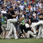 Coastal Carolina players celebrate their 4-3 victory over Arizona to win the championship after Game 3 of the NCAA College World Series baseball finals in Omaha, Neb., Thursday, June 30, 2016. (AP Photo/Ted Kirk)