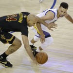 Cleveland Cavaliers forward Richard Jefferson (24) reaches for the ball in front of Golden State Warriors guard Stephen Curry during the first half of Game 7 of basketball's NBA Finals in Oakland, Calif., Sunday, June 19, 2016. (AP Photo/Eric Risberg)