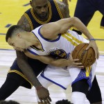 Golden State Warriors guard Stephen Curry (30) is guarded by Cleveland Cavaliers forward LeBron James during the first half of Game 1 of basketball's NBA Finals in Oakland, Calif., Thursday, June 2, 2016. (AP Photo/Marcio Jose Sanchez)