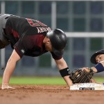Houston Astros second baseman Jose Altuve, right, unsuccessfully tries to tag out Arizona Diamondbacks' Brandon Drury at second base during the third inning of a baseball game, Wednesday, June 1, 2016, in Houston. (AP Photo/Eric Christian Smith)