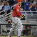 Arizona pitcher JC Cloney reacts to the final out against Coastal Carolina in the ninth inning in Game 1 of the NCAA Men's College World Series finals baseball game in Omaha, Neb., Monday, June 27, 2016. Arizona won 3-0. (AP Photo/Nati Harnik)