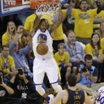 Golden State Warriors forward Andre Iguodala (9) dunks against the Cleveland Cavaliers during the second half of Game 1 of basketball's NBA Finals in Oakland, Calif., Thursday, June 2, 2016. (AP Photo/Marcio Jose Sanchez)