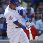 Chicago Cubs' Addison Russell hits a two-run double against the Arizona Diamondbacks during the eighth inning of a baseball game Friday, June 3, 2016, in Chicago. (AP Photo/Nam Y. Huh)