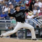 Coastal Carolina pitcher Alex Cunningham throws against Arizona in the seventh inning in Game 3 of the NCAA College World Series baseball finals in Omaha, Neb., Thursday, June 30, 2016. (AP Photo/Nati Harnik)