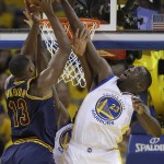 Golden State Warriors forward Draymond Green (23) defends a shot by Cleveland Cavaliers center Tristan Thompson (13) during the first half of Game 1 of basketball's NBA Finals in Oakland, Calif., Thursday, June 2, 2016. (AP Photo/Marcio Jose Sanchez)