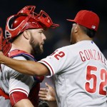 Philadelphia Phillies' Severino Gonzalez (52) hugs catcher Cameron Rupp after the final out of the ninth inning of a baseball game against the Arizona Diamondbacks Monday, June 27, 2016, in Phoenix. The Phillies defeated the Diamondbacks 8-0. (AP Photo/Ross D. Franklin)