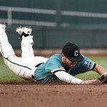 Coastal Carolina shortstop Michael Paez (1) dives to stop an Arizona Bobby Dalbec ground ball in the fourth inning in Game 2 of the NCAA Men's College World Series finals baseball game in Omaha, Neb., Tuesday, June 28, 2016. Dalbec had a single on the play. (AP Photo/Ted Kirk)