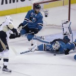 San Jose Sharks goalie Martin Jones (31) blocks a shot by Pittsburgh Penguins' Brian Dumoulin, left, during the second period of Game 4 of the NHL hockey Stanley Cup Finals, Monday, June 6, 2016, in San Jose, Calif. (AP Photo/Eric Risberg)