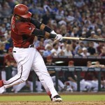Arizona Diamondbacks' Rickie Weeks follows through on a swing for a double against the Los Angeles Dodgers during the fourth inning of a baseball game Wednesday, June 15, 2016, in Phoenix. (AP Photo/Ross D. Franklin)