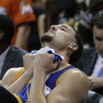 Golden State Warriors guard Klay Thompson reacts on the bench against the Cleveland Cavaliers during the second half of Game 6 of basketball's NBA Finals in Cleveland, Thursday, June 16, 2016. Cleveland won 115-101. (AP Photo/Tony Dejak)
