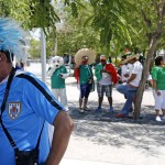 A Uruguay soccer fan, left, and Mexico soccer fans try to find shade outside of University of Phoenix Stadium as temperatures hit over 100 degrees prior to a Copa America Group C soccer match at Sunday, June 5, 2016, in Glendale, Ariz. (AP Photo/Ross D. Franklin)