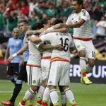Mexico's Hector Herrera (16) celebrates his goal against Uruguay with teammates, including Jesus Manuel Corona (10), during the first half of a Copa America soccer match at University of Phoenix Stadium, Sunday, June 5, 2016, in Glendale, Ariz. (AP Photo/Ross D. Franklin)
