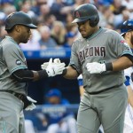 Arizona Diamondbacks left fielder Yasmany Tomas, right, celebrates his two run home run against the Toronto Blue Jays with teammate Rickie Weeks during the fourth inning of a baseball game, Tuesday, June 21, 2016, in Toronto. (Nathan Denette/The Canadian Press via AP) MANDATORY CREDIT