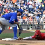 Arizona's JJ Matijevic, right, dives safely back to first ahead of the tag from UC Santa Barbara first baseman Austin Bush on a pickoff attempt by UC Santa Barbara's Justin Kelly, left rear, during the second inning of an NCAA College World Series baseball game Wednesday, June 22, 2016, in Omaha, Neb. (AP Photo/Ted Kirk)