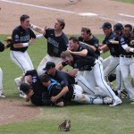 Coastal Carolina players celebrate their 4-3 victory over Arizona to win the championship after Game 3 of the NCAA College World Series baseball finals in Omaha, Neb., Thursday, June 30, 2016. (AP Photo/Nati Harnik)