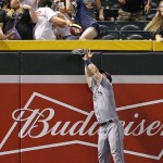 Tampa Bay Rays' Corey Dickerson jumps in vain for three-run home run by Arizona Diamondbacks' Jake Lamb during the fourth inning of a baseball game Tuesday, June 7, 2016, in Phoenix. (AP Photo/Ross D. Franklin)