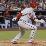 Philadelphia Phillies' Cody Asche watches the flight of his run-scoring single against the Arizona Diamondbacks during the seventh inning of a baseball game Wednesday, June 29, 2016, in Phoenix. (AP Photo/Ross D. Franklin)