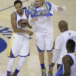 Golden State Warriors guard Shaun Livingston, left, and guard Klay Thompson celebrate during the second half of Game 1 of basketball's NBA Finals against the Cleveland Cavaliers in Oakland, Calif., Thursday, June 2, 2016. (AP Photo/Marcio Jose Sanchez)