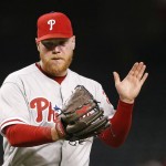 Philadelphia Phillies' Brett Oberholtzer slaps his hand in his glove in celebration after the final out against the Arizona Diamondbacks, during the 10th inning of a baseball game Wednesday, June 29, 2016, in Phoenix. The Phillies defeated the Diamondbacks 9-8. (AP Photo/Ross D. Franklin)
