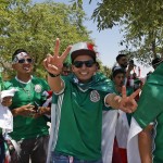 Mexico soccer fans smile as they watch other fans heckle Uruguay fans prior to a Copa America Group C soccer match  at University of Phoenix Stadium, Sunday, June 5, 2016, in Glendale, Ariz. (AP Photo/Ross D. Franklin)