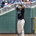 Coastal Carolina's G.K. Young reacts to hitting a double against Arizona in the fifth inning in Game 3 of the NCAA College World Series baseball finals in Omaha, Neb., Thursday, June 30, 2016. (AP Photo/Ted Kirk)