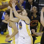 Golden State Warriors guard Klay Thompson (11) shoots against Cleveland Cavaliers guard J.R. Smith (5) during the first half of Game 7 of basketball's NBA Finals in Oakland, Calif., Sunday, June 19, 2016. (AP Photo/Eric Risberg)