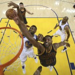 Golden State Warriors center Festus Ezeli (31) defends a shot by Cleveland Cavaliers center Tristan Thompson (13) during the second half of Game 2 of basketball's NBA Finals in Oakland, Calif., Thursday, June 2, 2016. The Warriors won 104-89. (Ezra Shaw, Getty Images via AP, Pool)