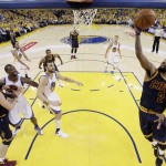 Cleveland Cavaliers' Kyrie Irving (2) drives to the basket against the Golden State Warriors during the first half in Game 1 of basketball's NBA Finals Thursday, June 2, 2016, in Oakland, Calif. (AP Photo/Marcio Jose Sanchez, Pool)