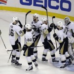 The Pittsburgh Penguins celebrate at the end of Game 4 of the NHL hockey Stanley Cup Finals against the San Jose Sharks in San Jose, Calif., Monday, June 6, 2016. Pittsburgh won the game 3-1. (AP Photo/Eric Risberg)