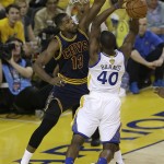 Golden State Warriors forward Harrison Barnes (40) shoots as he is defended by Cleveland Cavaliers center Tristan Thompson (13) during the first half of Game 1 of basketball's NBA Finals in Oakland, Calif., Thursday, June 2, 2016. (AP Photo/Ben Margot)