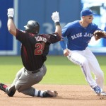 Arizona Diamondbacks' Yasmany Tomas slides safely into second with a double past Toronto Blue Jays' Troy Tulowitzki during the fourth inning of an interleague baseball game, Wednesday, June 22, 2016, in Toronto. (Fred Thornhill/The Canadian Press via AP) MANDATORY CREDIT