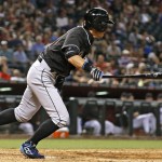 Miami Marlins' Ichiro Suzuki heads to first base as he hits a grounder against the Arizona Diamondbacks during the eighth inning of a baseball game Friday, June 10, 2016, in Phoenix. Suzuki was safe at first,  and Jeff Mathis was forced out at second. (AP Photo/Ross D. Franklin)