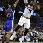 Cleveland Cavaliers forward LeBron James (23) shoots over Golden State Warriors guard Leandro Barbosa (19) during the second half of Game 6 of basketball's NBA Finals in Cleveland, Thursday, June 16, 2016. (AP Photo/Tony Dejak)