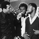 FILE - In this July 17, 1975, file photo, sports promoter Don King stands between Muhammad Ali, left, the heavyweight champion, and Joe Frazier in New York. Ali, the magnificent heavyweight champion whose fast fists and irrepressible personality transcended sports and captivated the world, has died according to a statement released by his family Friday, June 3, 2016. He was 74.
(AP Photo/File)