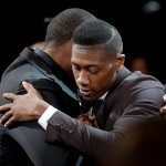Kris Dunn hugs a supporter after being selected fifth overall by the Minnesota Timberwolves during the NBA basketball draft, Thursday, June 23, 2016, in New York. (AP Photo/Frank Franklin II)