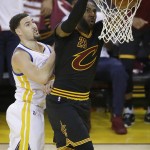 Cleveland Cavaliers forward LeBron James (23) dunks in front of Golden State Warriors guard Klay Thompson during the first half of Game 7 of basketball's NBA Finals in Oakland, Calif., Sunday, June 19, 2016. (AP Photo/Eric Risberg)