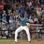 Coastal Carolina pitcher Bobby Holmes reacts to the final out against Arizona in the ninth inning in Game 2 of the NCAA Men's College World Series finals baseball game in Omaha, Neb., Tuesday, June 28, 2016. Coastal Carolina won 5-4. (AP Photo/Ted Kirk)