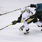 Pittsburgh Penguins' Evgeni Malkin, left, moves the puck past San Jose Sharks' Brenden Dillon during the second period of Game 4 of the NHL hockey Stanley Cup Finals, Monday, June 6, 2016, in San Jose, Calif. (AP Photo/Eric Risberg)