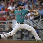 Coastal Carolina relief pitcher Cole Schaefer throws against Arizona in the first inning in Game 1 of the NCAA Men's College World Series finals baseball game in Omaha, Neb., Monday, June 27, 2016. (AP Photo/Ted Kirk)
