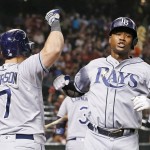 Tampa Bay Rays' Tim Beckham, right, celebrates his two-run home run against the Arizona Diamondbacks with Logan Morrison, left, during the fifth inning of a baseball game Monday, June 6, 2016, in Phoenix. (AP Photo/Ross D. Franklin)