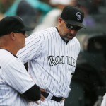 Colorado Rockies manager Walt Weiss, right, confers with bench coach Tom Runnells as they face the Arizona Diamondbacks in the seventh inning of a baseball game Saturday, June 25, 2016, in Denver. (AP Photo/David Zalubowski)