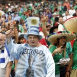 Fans for Mexico and Uruguay cheer on their teams as they walk onto the field prior to a Copa America soccer match at University of Phoenix Stadium, Sunday, June 5, 2016, in Glendale, Ariz. (AP Photo/Ross D. Franklin)