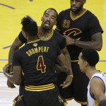 Cleveland Cavaliers guard Iman Shumpert (4) reacts with J.R. Smith, center, and forward LeBron James (23) during the first half of Game 7 of basketball's NBA Finals against the Golden State Warriors in Oakland, Calif., Sunday, June 19, 2016. (AP Photo/Eric Risberg)