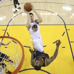 Golden State Warriors guard Klay Thompson (11) shoots over Cleveland Cavaliers guard J.R. Smith (5) during the first half of Game 2 of basketball's NBA Finals in Oakland, Calif., Thursday, June 2, 2016. (Ezra Shaw, Getty Images via AP, Pool)