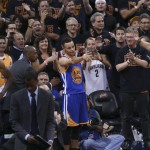 Golden State Warriors guard Stephen Curry (30) points to the court after fouling out against the Cleveland Cavaliers during the second half of Game 6 of basketball's NBA Finals in Cleveland, Thursday, June 16, 2016. Cleveland won 115-101. (AP Photo/Ron Schwane)
