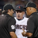 Arizona Diamondbacks manager Chip Hale, middle, argues with umpires Mark Ripperger, left, and Kerwin Danley before Hale was thrown out of the game for arguing a called third strike during the fourth inning of the team's baseball game against the Tampa Bay Rays on Tuesday, June 7, 2016, in Phoenix. (AP Photo/Ross D. Franklin)