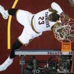 Cleveland Cavaliers forward LeBron James (23) dunks against the Golden State Warriors during the first half of Game 6 of basketball's NBA Finals in Cleveland, Thursday, June 16, 2016. (AP Photo/Ron Schwane)