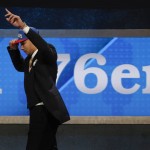 LSU's Ben Simmons raises his hand as he walks off the stage after being selected as the top pick by the Philadelphia 76ers during the NBA basketball draft, Thursday, June 23, 2016, in New York. (AP Photo/Frank Franklin II)